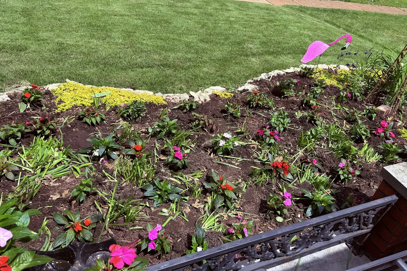 Residential planting bed during weed removal and bed care